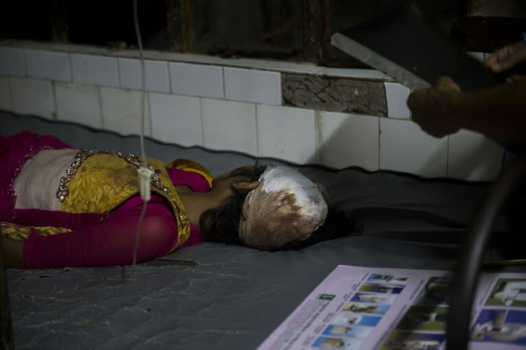 18-year-old Rohingya refugee Shuktara rests on a bed Chittagong Medical College hospital on September 7, 2017. The hospital is the only facility in the area with the facilities to treat serious gunshot wounds and has been utterly overwhelmed