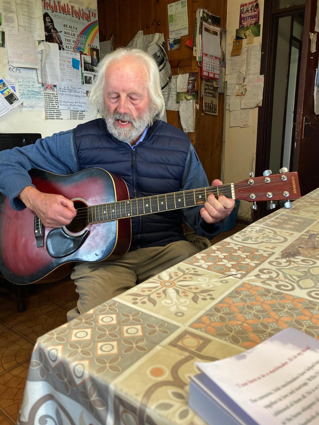 Willy Daly, the best-known of the traditional Irish matchmakers, sits at his kitchen table and sings an Irish ballad.