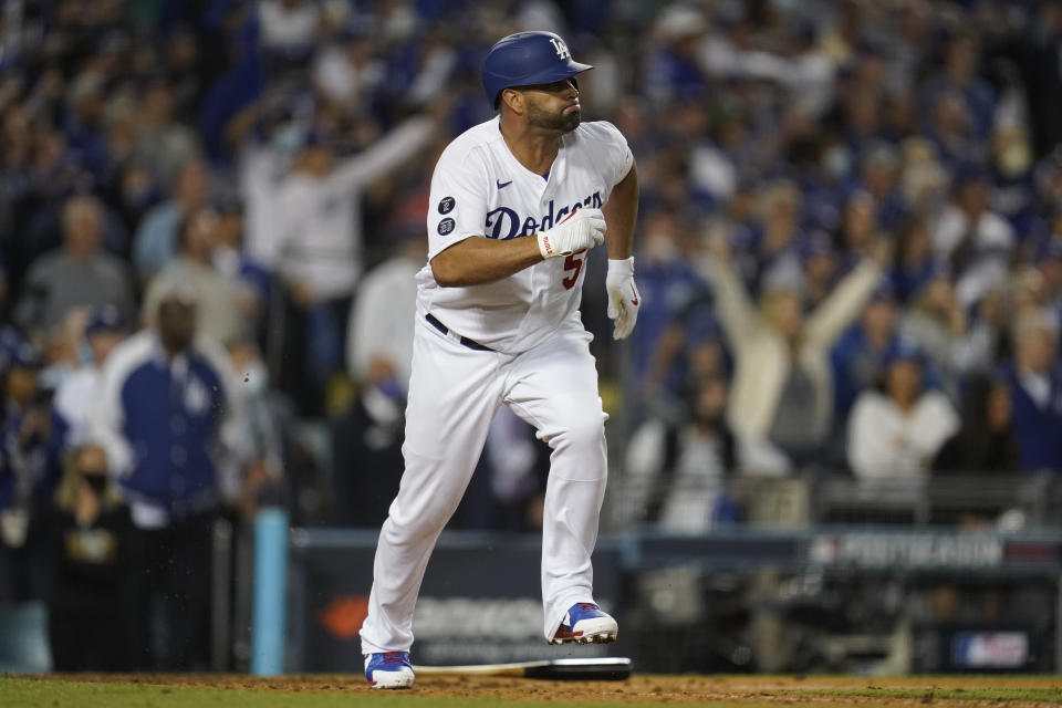 Los Angeles Dodgers' Albert Pujols runs to first as he lines out to center field during the ninth inning of a National League Wild Card playoff baseball game against the St. Louis Cardinals Wednesday, Oct. 6, 2021, in Los Angeles. (AP Photo/Marcio Jose Sanchez)