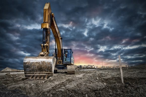 An excavator in a field.