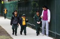 Children return to campus for the first day of New South Wales public schools fulling re-opening in Sydney