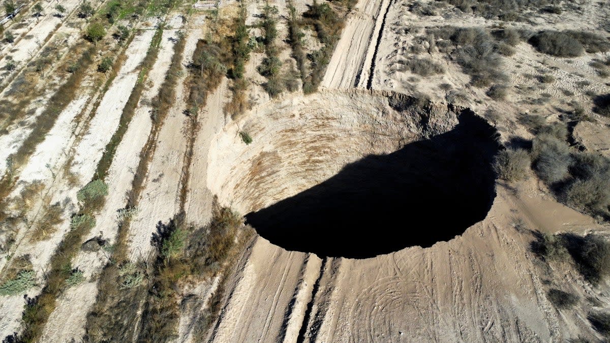 A sinkhole is exposed at a mining zone close to Tierra Amarilla town, in Copiapo, Chile (REUTERS)