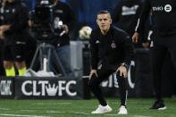 Toronto FC coach John Herdman watches the team play against Charlotte FC during the second half of an MLS soccer match in Charlotte, N.C., Saturday, April 13, 2024. (AP Photo/Nell Redmond)