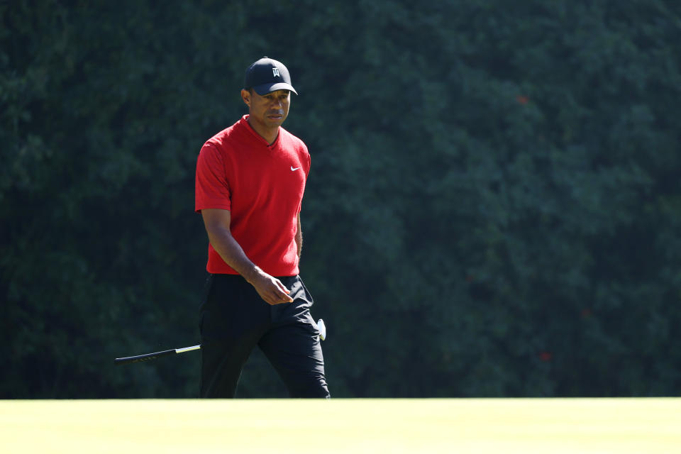 Though he’s only played three times this season, Tiger Woods is “just not quite ready” to return to the course while dealing with back stiffness. (Chris Trotman/Getty Images)