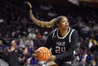Stephen F. Austin center Kurstyn Harden (24) handles the ball during the first half of an NCAA college basketball game against California Baptist in the championship of the Western Athletic Conference women's tournament Saturday, March 16, 2024, in Las Vegas. (AP Photo/David Becker)