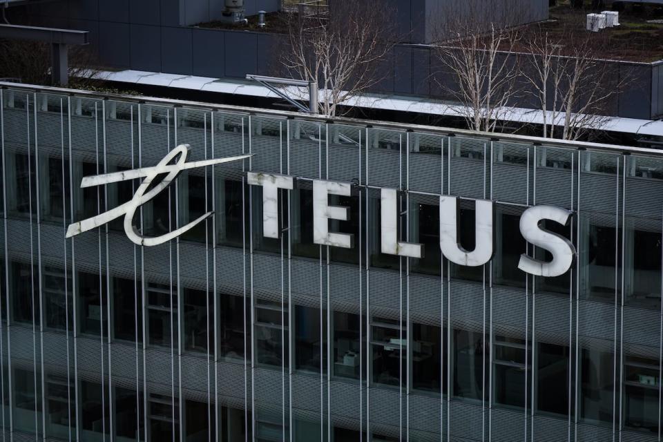 The Telus Corporation logo is seen outside the company's headquarters in downtown Vancouver, Thursday, Jan. 19, 2023.  Telus says it is offering buyouts to a large group of employees and expects several hundred workers to take them up. 