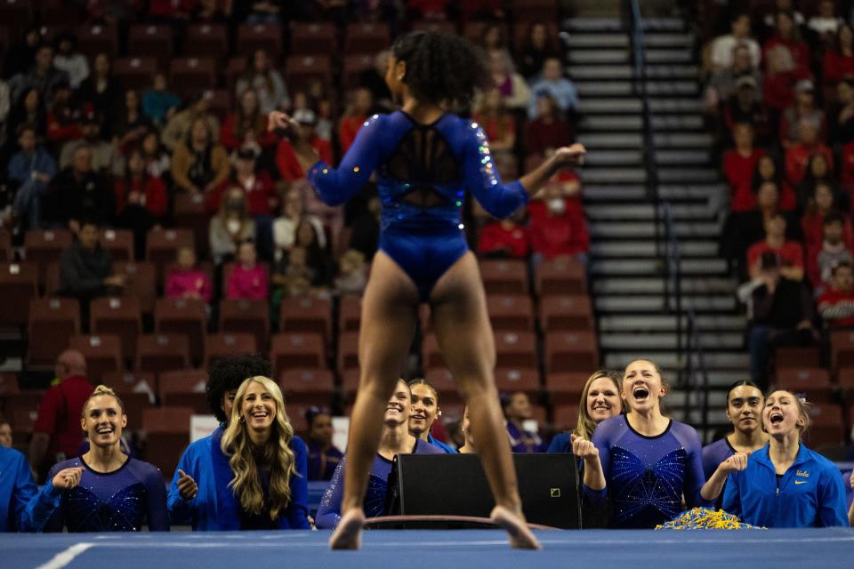 UCLA gymnastics teammates cheer on Selena Harris during her floor routine during the Sprouts Farmers Market Collegiate Quads at Maverik Center in West Valley on Saturday, Jan. 13, 2024. #1 Oklahoma, #2 Utah, #5 LSU, and #12 UCLA competed in the meet. | Megan Nielsen, Deseret News