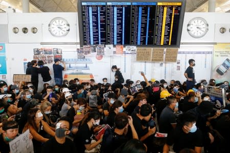 Anti-extradition bill protesters rally at the departure hall of Hong Kong airport in Hong Kong