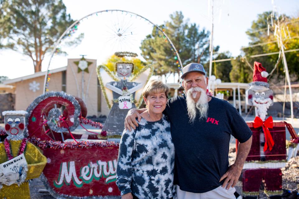 Judy and Tom Conner pose in front of their Christmas light display on Wednesday, Nov. 29, 2023, at their home in Las Cruces.