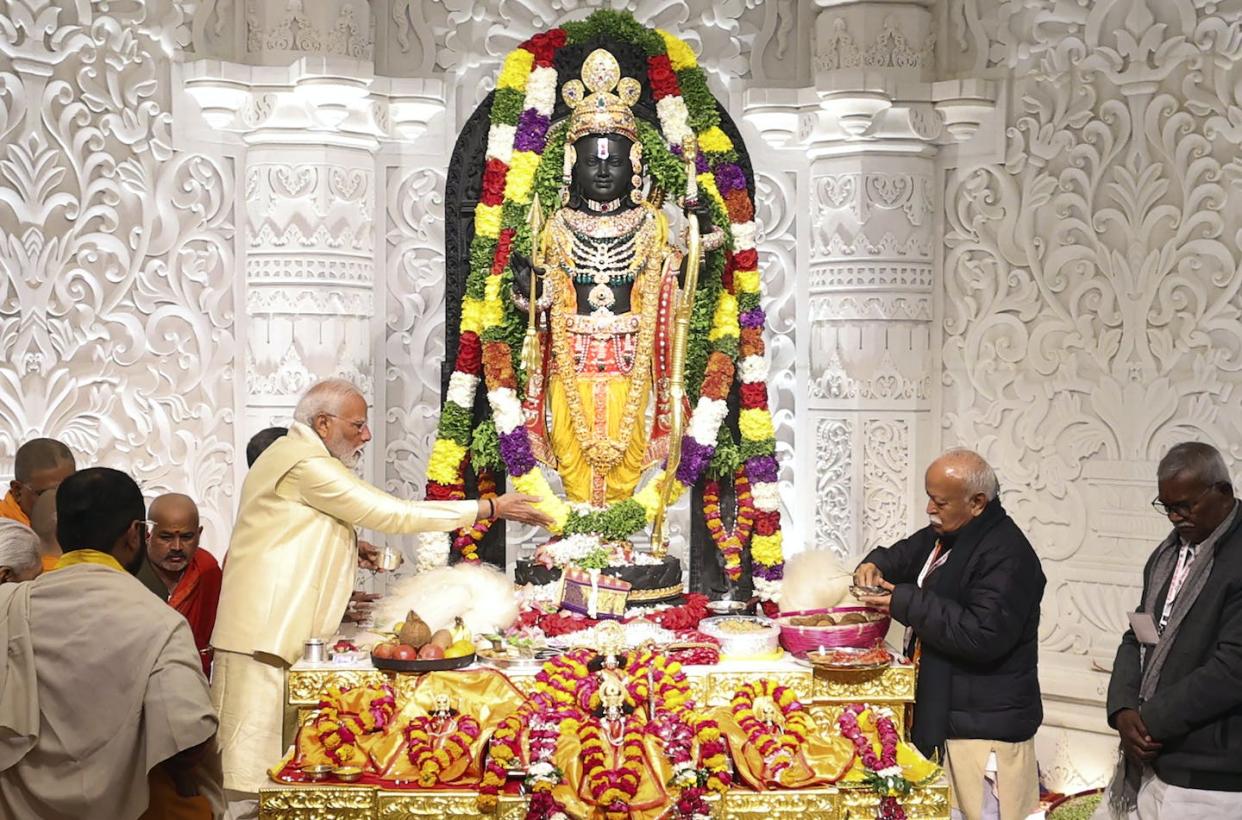 Prime Minister Narendra Modi, center left, performs rituals during the opening of the temple dedicated to Lord Ram in Ayodhya, India, on Jan. 22, 2024. <a href="https://newsroom.ap.org/detail/IndiaHinduTemple/8ee5a9844b5f4124965e6fd8b2525d08/photo?Query=rama%20temple%20india%20modi&mediaType=photo&sortBy=&dateRange=Anytime&totalCount=648&digitizationType=Digitized&currentItemNo=NaN&vs=true&vs=true" rel="nofollow noopener" target="_blank" data-ylk="slk:Press Information Bureau via AP;elm:context_link;itc:0;sec:content-canvas" class="link ">Press Information Bureau via AP</a>