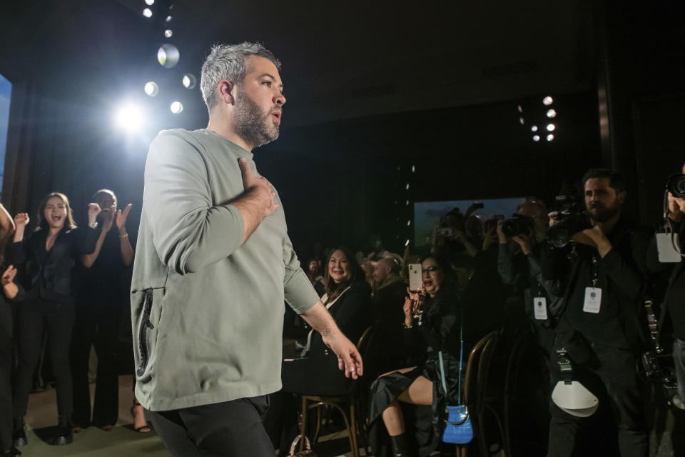 Designer Brandon Maxwell walks the runway at the end of his fashion show during NYFW Fall/Winter on Saturday, Feb. 8, 2020 in New York. (Photo by Charles Sykes/Invision/AP)