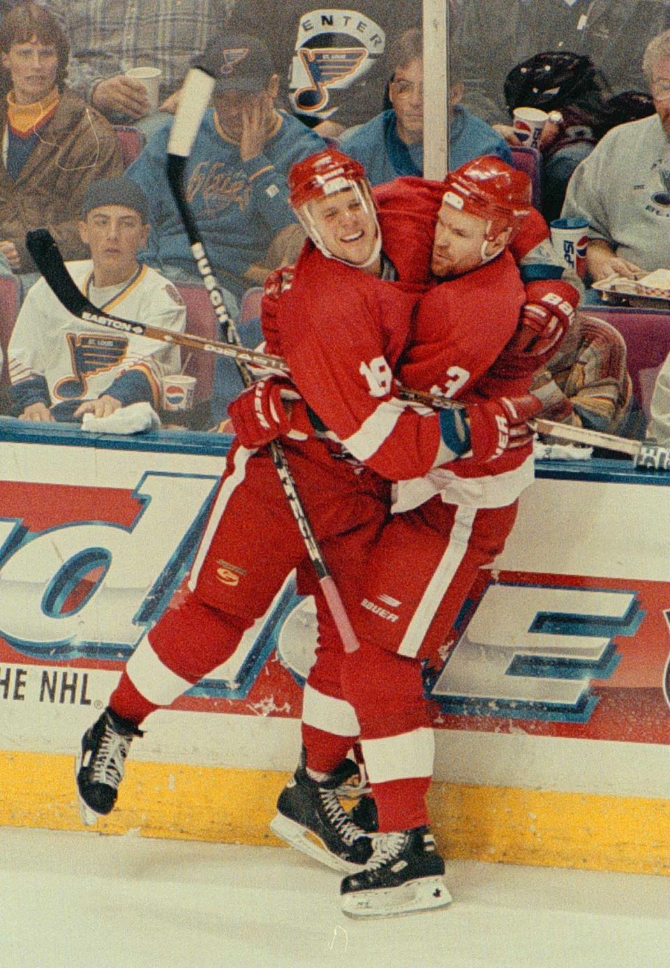 Red Wings forward Kirk Maltby and defenseman Bob Rouse celebrate Maltby's third goal that was scored in the third period of Game 6 of the first-round series against the Blues in St. Louis on April 27, 1997.