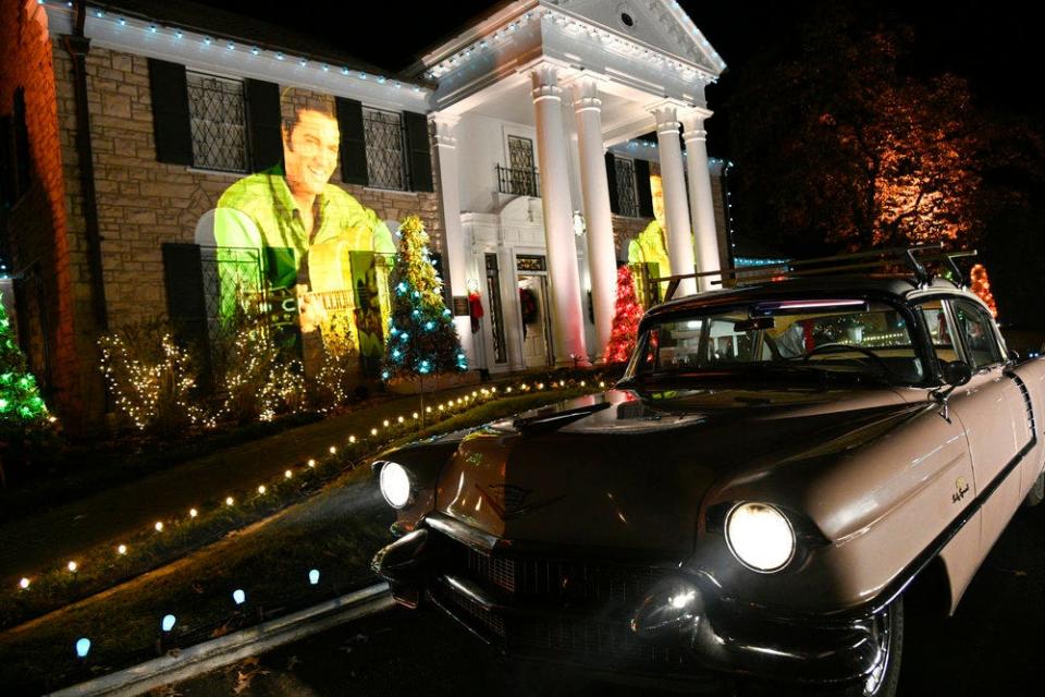 A photo of Elvis is projected on the Graceland mansion during NBC's "Christmas at Graceland" TV special on Wednesday, Nov. 29, 2023.