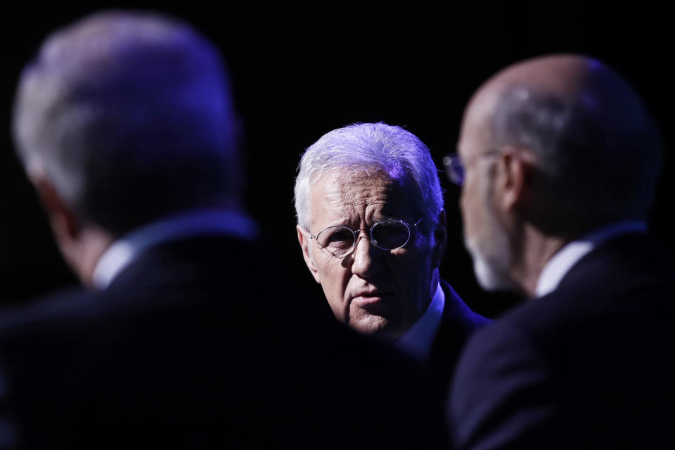 Moderator Alex Trebek, center, speaks during a gubernatorial debate between Democratic Gov. Tom Wolf, right, and Republican Scott Wagner in Hershey, Pa., Monday, Oct. 1, 2018. The debate is hosted by the Pennsylvania Chamber of Business and Industry. (AP Photo/Matt Rourke)