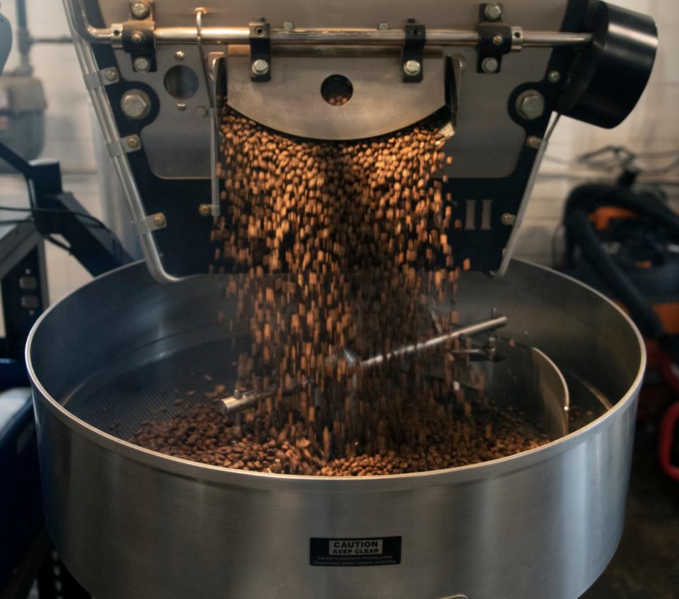 Roasted beans for the Guatemala Huehuetenango flavor are finished in the roaster at Bent Tree Coffee Company's production facility on Mogadore Road in Kent. The roastery plans to relocate to a building on North Mantua Street that is being renovated as a mixed use structure.