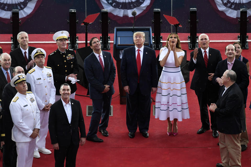 President Donald Trump, standing with first lady Melania Trump, Vice President Mike Pence and acting Defense Secretary Mark Esper, watches as the U.S. Navy Blue Angels fly over during a July Fourth celebration. (Photo: ASSOCIATED PRESS)