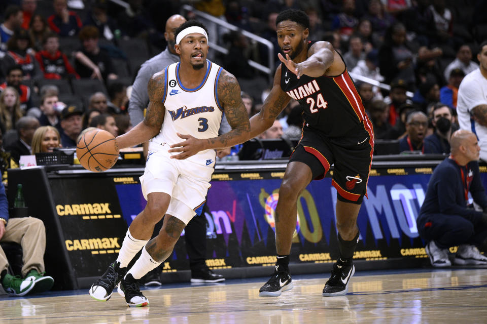 Washington Wizards guard Bradley Beal (3) drives against Miami Heat forward Haywood Highsmith (24) during the first half of an NBA basketball game Friday, Nov. 18, 2022, in Washington. (AP Photo/Nick Wass)