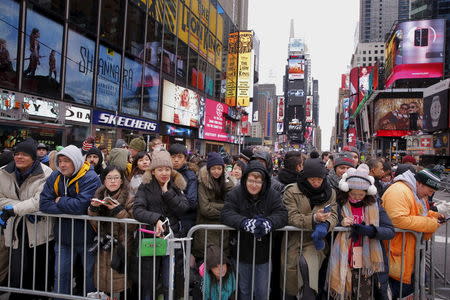 Revelers stand in pens as they await New Year's Eve festivities in the Times Square area of New York December 31, 2015. REUTERS/Lucas Jackson