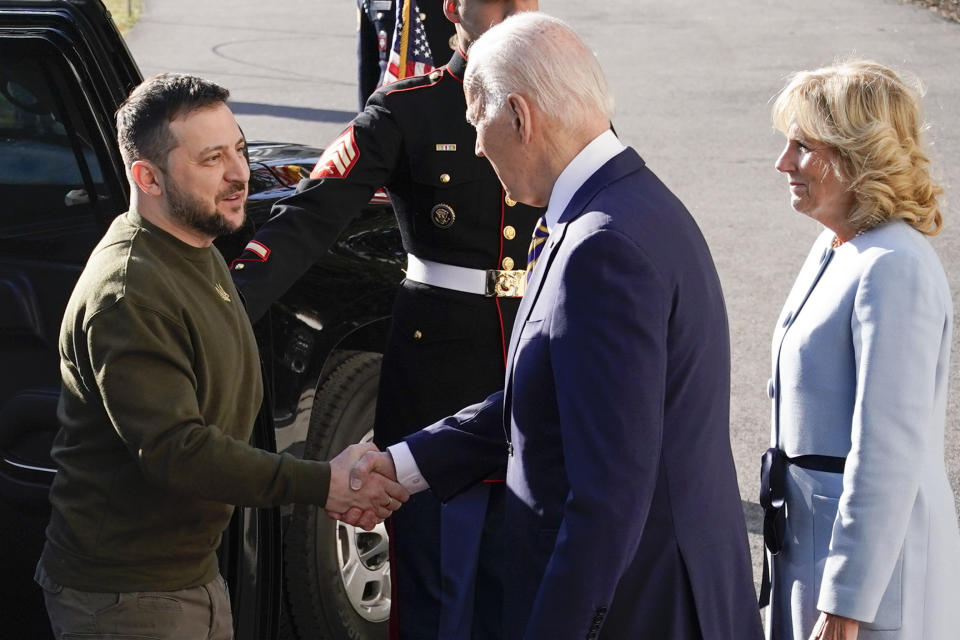 President Joe Biden shakes hands with Ukrainian President Volodymyr Zelenskyy as he welcomes him to the White House, Wednesday, Dec. 21, 2022, in Washington. First lady Jill Biden is at right. (AP Photo/Patrick Semansky)