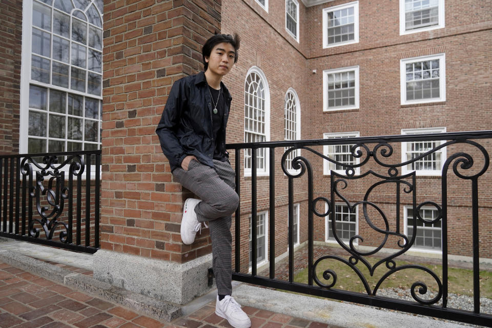 Nicholas Sugiarto, of San Diego, Calif., a student at Dartmouth College, stands for a photograph on the school's campus, Tuesday, April 20, 2021, in Hanover, N.H. A wave of anti-Asian attacks that started more than a year ago with the pandemic, along with the March 2021 shootings in Atlanta that left six Asian women dead, have provoked national conversations about the visibility of Asian Americans. (AP Photo/Steven Senne)