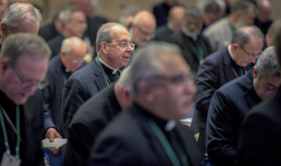 William Lori, Archbishop of Baltimore, stands during the opening prayer of the United States Conference of Catholic Bishops Fall General Assembly at the Baltimore Marriott Waterfront Monday, Nov. 11, 2019. (Jerry Jackson/The Baltimore Sun via AP)