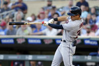 Cleveland Guardians' Steven Kwan hits an RBI triple against the Minnesota Twins during the third inning of a baseball game Wednesday, June 22, 2022, in Minneapolis. (AP Photo/Andy Clayton-King)