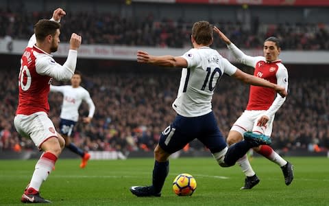 Harry Kane of Tottenham Hotspur in action during the Premier League match at Arsenal - Credit: Getty