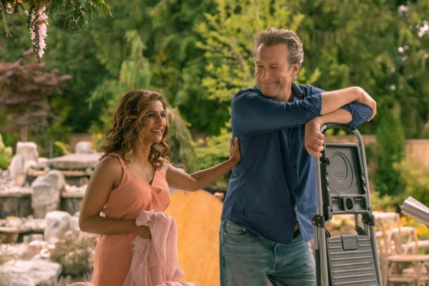 Sarayu Blue and John Corbett as Trina and Dan.