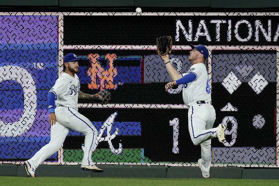 Kansas City Royals right fielder Ryan O'Hearn, right, catches a fly ball for the out on Detroit Tigers' Spencer Torkelson during the sixth inning of the second game of a baseball doubleheader Monday, July 11, 2022, in Kansas City, Mo. (AP Photo/Charlie Riedel)