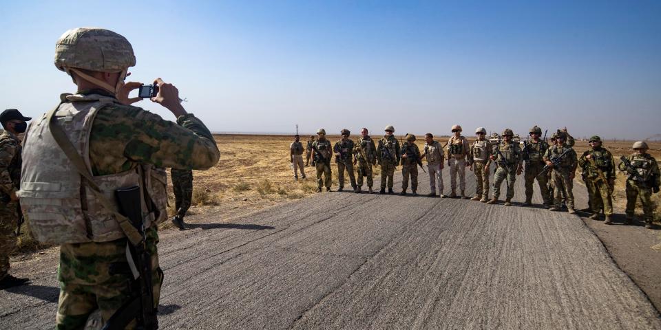 soldier takes group photo