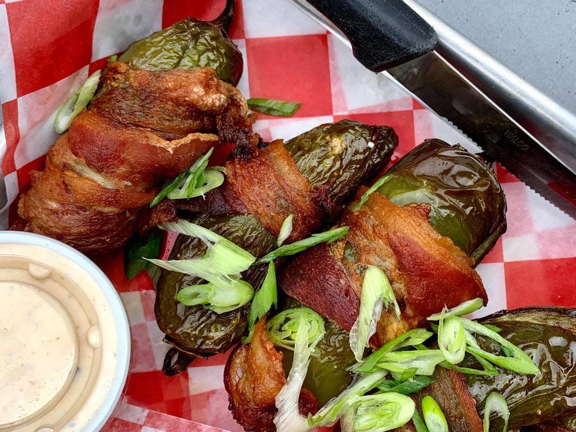 Order some jalapeno poppers for the table while watching the Mariners games at Ale House Pub in UP.
