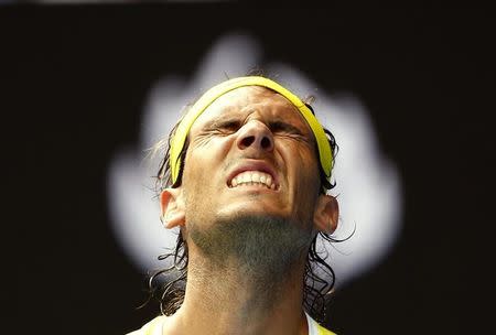 Spain's Rafael Nadal reacts during his first round match against Spain's Fernando Verdasco at the Australian Open tennis tournament at Melbourne Park, Australia, January 19, 2016. REUTERS/Thomas Peter