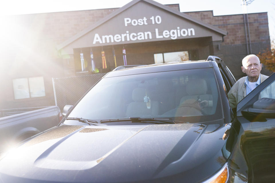 Pearl Harbor survivor and World War II Navy veteran David Russell, 101, gets in his car after eating breakfast at the American Legion Post 10 on Monday, Nov. 22, 2021, in Albany, Ore. (AP Photo/Nathan Howard)