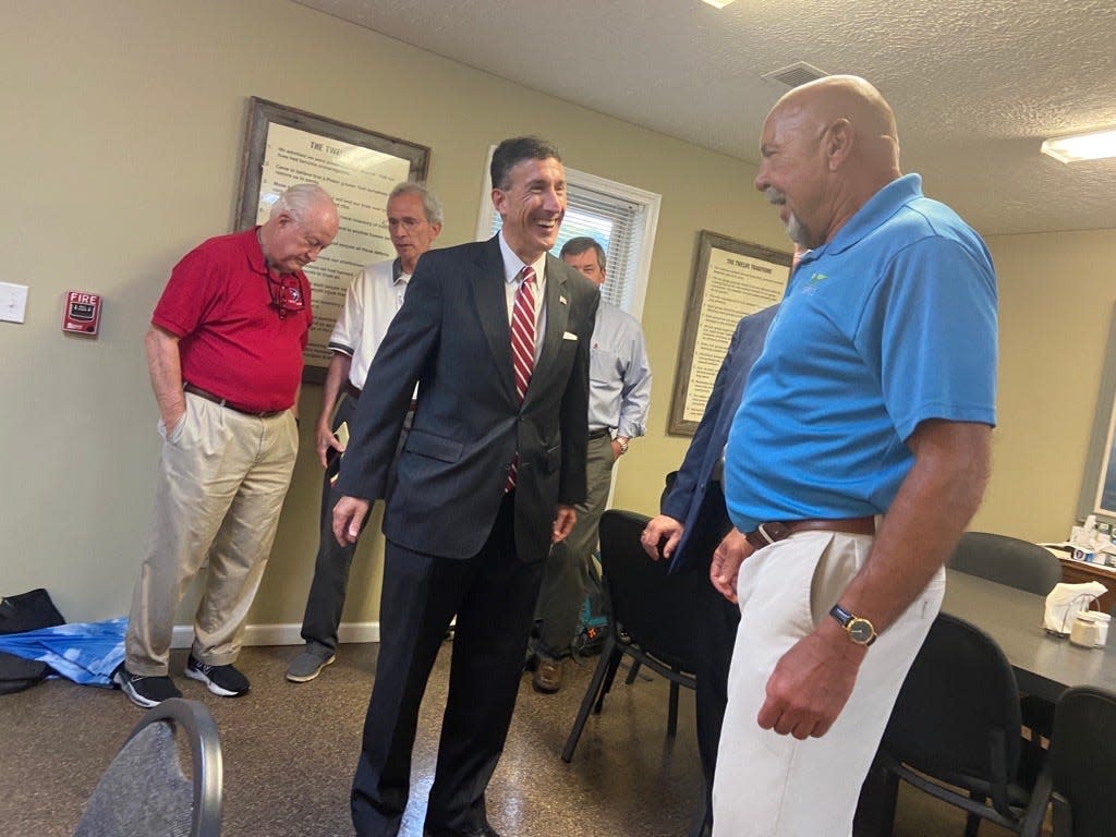 U.S. Congressman David Kustoff and Aspell Recovery Center Director Richard Barber share a laugh while talking on June 6, 2022, at Aspell's campus in Downtown Jackson.