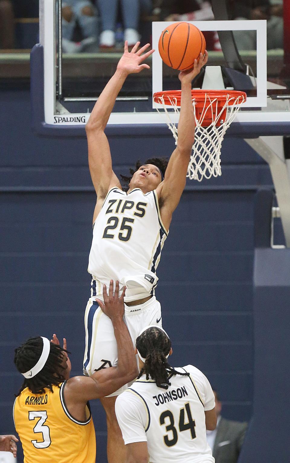 University of Akron's Enrique Freeman goes up to block a second-half shot at the rim against Southern Miss on Friday in Akron.