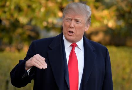 U.S. President Donald Trump responds to a reporter's question about North Korea as he departs the White House, Washington, DC, U.S., for a day trip to suburban Pittsburgh, Pennsylvania, for a Make America Great Again rally supporting Republican candidate Rick Saccone, March 10, 2018. REUTERS/Mike Theiler/Files