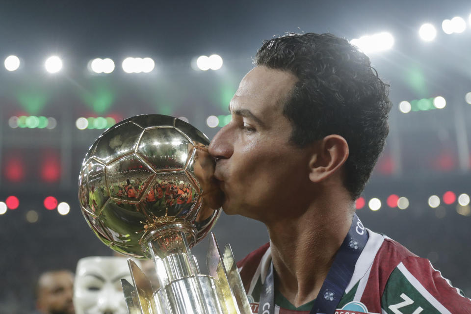 PH Ganso of Brazil's Fluminense kisses the trophy as he celebrates after winning the Recopa Sudamericana final soccer match against Ecuador's Liga Deportiva Universitaria at Maracana stadium in Rio de Janeiro, Brazil, Thursday, Feb. 29, 2024. (AP Photo/Bruna Prado)