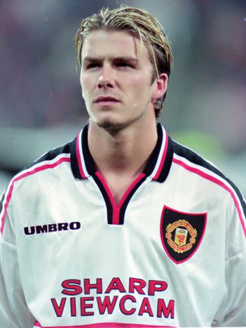 <p>Etsuo Hara/Getty</p> David Beckham prior to the UEFA Champions League Group D match in 1998.