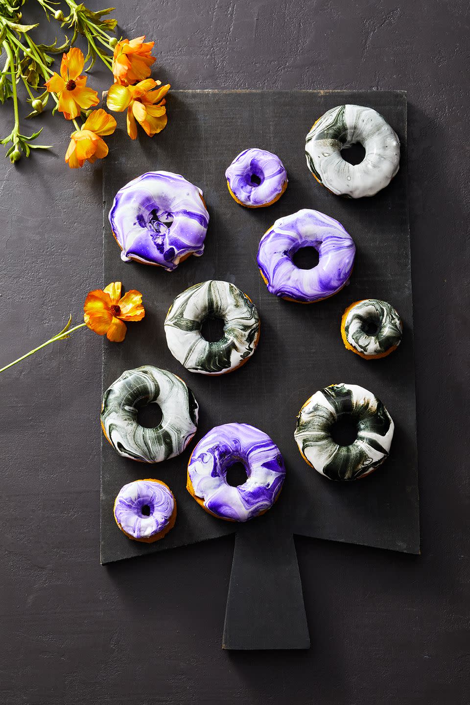 <p>Use gel food coloring to make the glaze, swirl it around and dip the no-fry, pumpkin cake donuts right in — voila! <br><br>Get the <a href="https://www.goodhousekeeping.com/food-recipes/dessert/a41530337/dip-dyed-donuts-recipe/" rel="nofollow noopener" target="_blank" data-ylk="slk:Dip-Dyed Donuts recipe;elm:context_link;itc:0;sec:content-canvas" class="link "><strong>Dip-Dyed Donuts recipe</strong></a>.</p>