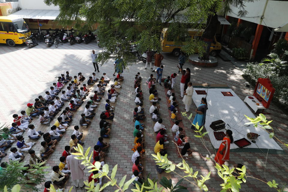 Students attend morning assembly on the first day of partial reopening of schools in Prayagraj, India, Wednesday, Sept. 1, 2021. More students in India will be able to step inside a classroom for the first time in nearly 18 months Wednesday, as authorities have given the green light to partially reopen more schools despite apprehension from some parents and signs that infections are picking up again. Schools and colleges in at least six more states will reopen in a gradual manner with health measures in place throughout September. (AP Photo/Rajesh Kumar Singh)