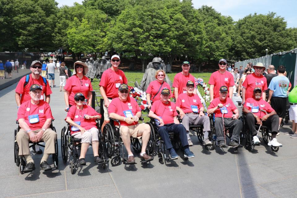 Seven of the 24 veterans on the second First Coast Honor Flight visit the Korean War Memorial with their "Guardians," who assisted in their special day.