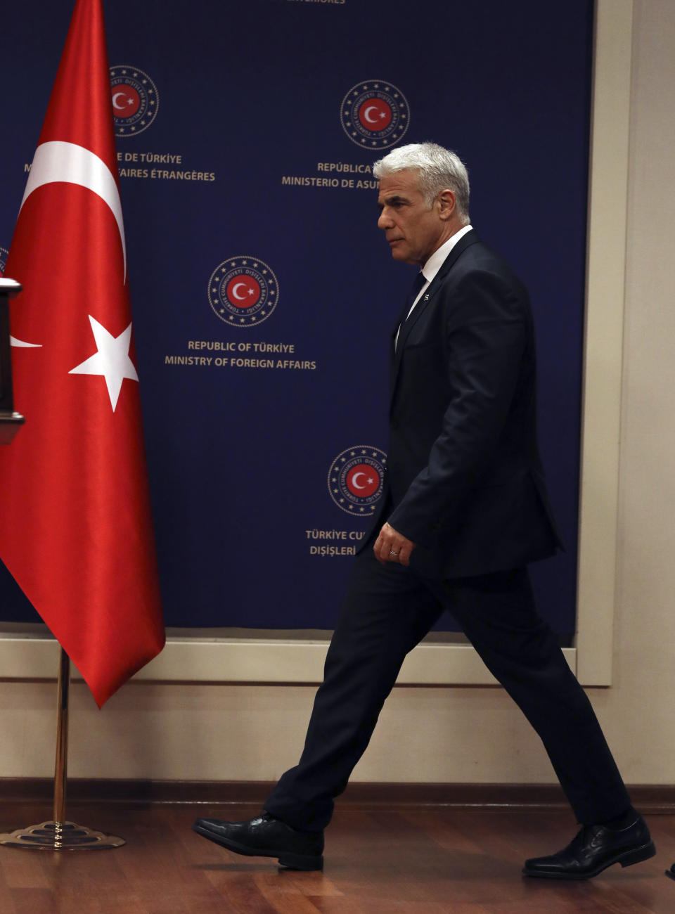 Israeli Foreign Minister Yair Lapid arrives to speak to the media after talks with Turkish Foreign Minister Mevlut Cavusoglu, in Ankara, Turkey, Thursday, June 23, 2022. Lapid on Thursday thanked Turkish authorities for their cooperation in allegedly foiling attacks against Israeli citizens in Turkey and warned Israel would not "sit idly by " in the face of threats to its citizens from Iran.(AP Photo/Burhan Ozbilici)