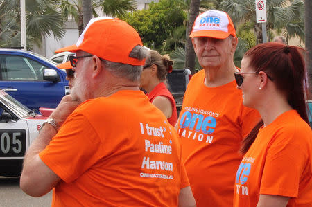 Supporters of the Australian senator Pauline Hanson wear shirts displaying her One Nation Party logo in the northern Australian town of Townsville in Queensland, Australia, November 10, 2017. Picture taken November 10, 2017. REUTERS/Jonathan Barrett