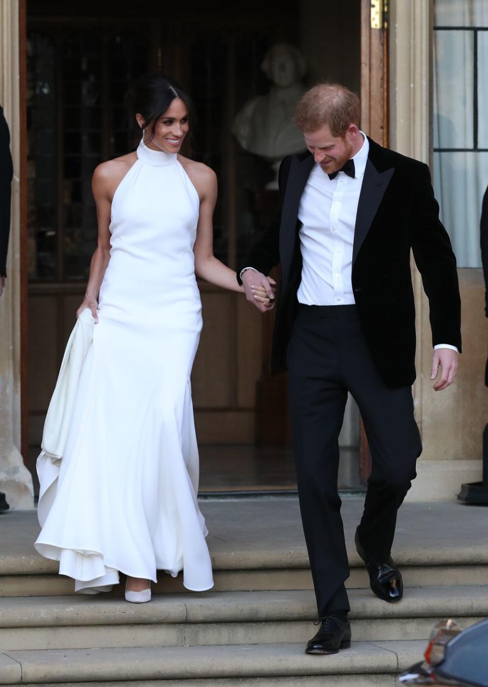 <p>For her evening reception Meghan slipped into this <a href="https://www.cosmopolitan.com/uk/fashion/celebrity/a19847955/meghan-markle-second-wedding-dress/" rel="nofollow noopener" target="_blank" data-ylk="slk:slinky halterneck gown;elm:context_link;itc:0;sec:content-canvas" class="link ">slinky halterneck gown</a> by British designer Stella McCartney. In fact we were so busy staring at the dress that we almost missed the <a href="https://www.cosmopolitan.com/uk/fashion/celebrity/a20760782/meghan-markle-princess-diana-ring-blue-wedding-reception/" rel="nofollow noopener" target="_blank" data-ylk="slk:turquoise ring;elm:context_link;itc:0;sec:content-canvas" class="link ">turquoise ring</a> on her finger, which belonged to Princess Diana and was a gift to Meghan from her new husband. </p>