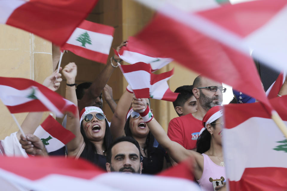 Anti-government protesters shout slogans against the Lebanese government during a protest in Beirut, Lebanon, Monday, Oct. 21, 2019. Lebanon's Cabinet approved Monday sweeping reforms that it hopes will appease thousands of people who have been protesting for five days, calling on Prime Minister Saad Hariri's government to resign. (AP Photo/Hassan Ammar)