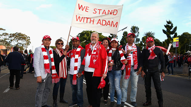 Swans fans stand for Adam.