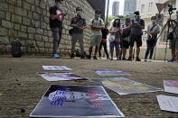 Pro-China supporters display a picture of U.S. President Donald Trump reading "Despicable and shameless" during a protest against the U.S. sanctions outside the U.S. Consulate in Hong Kong Saturday, Aug. 8, 2020. The U.S. on Friday imposed sanctions on Hong Kong officials, including the pro-China leader of the government, accusing them of cooperating with Beijing's effort to undermine autonomy and crack down on freedom in the former British colony. (AP Photo/Vincent Yu)