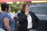 <p>Orange County Mayor Teresa Jacobs, right, is briefed after arriving to the scene of a fatal shooting at Pulse Orlando nightclub in Orlando, Fla., Sunday, June 12, 2016. (AP Photo/Phelan M. Ebenhack) </p>