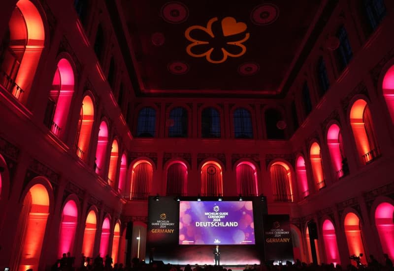 Markus Bast, Michelin Managing Director DACH, speaks on stage during the award ceremony for the Michelin Stars 2024 for German restaurants at the Chamber of Commerce. Marcus Brandt/dpa