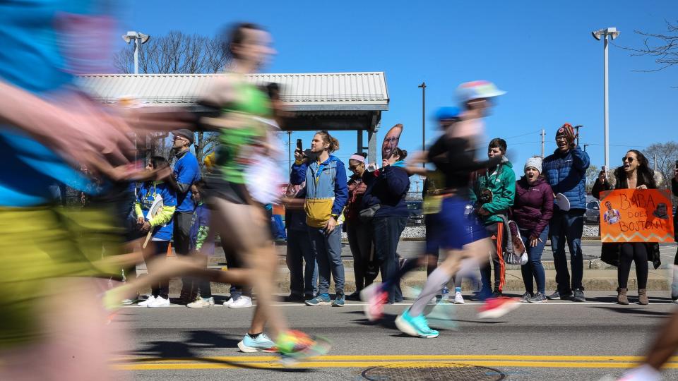 Spectators line Waverly Street to cheer on runners during the 126th running of the Boston Marathon in Framingham, April 18, 2022.
